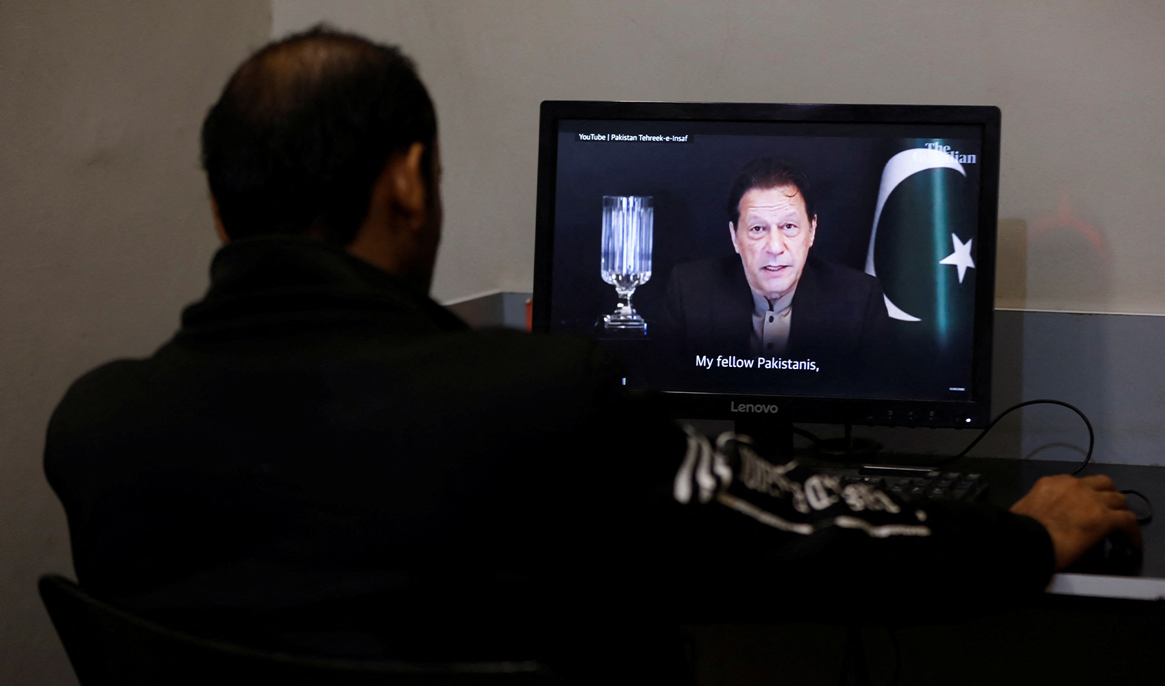 A man views a computer screen displaying the AI-crafted speech of former Prime Minister Imran Khan, to call for votes ahead of the general elections in Karachi, Pakistan, on February 2, 2024. (REUTERS/File)