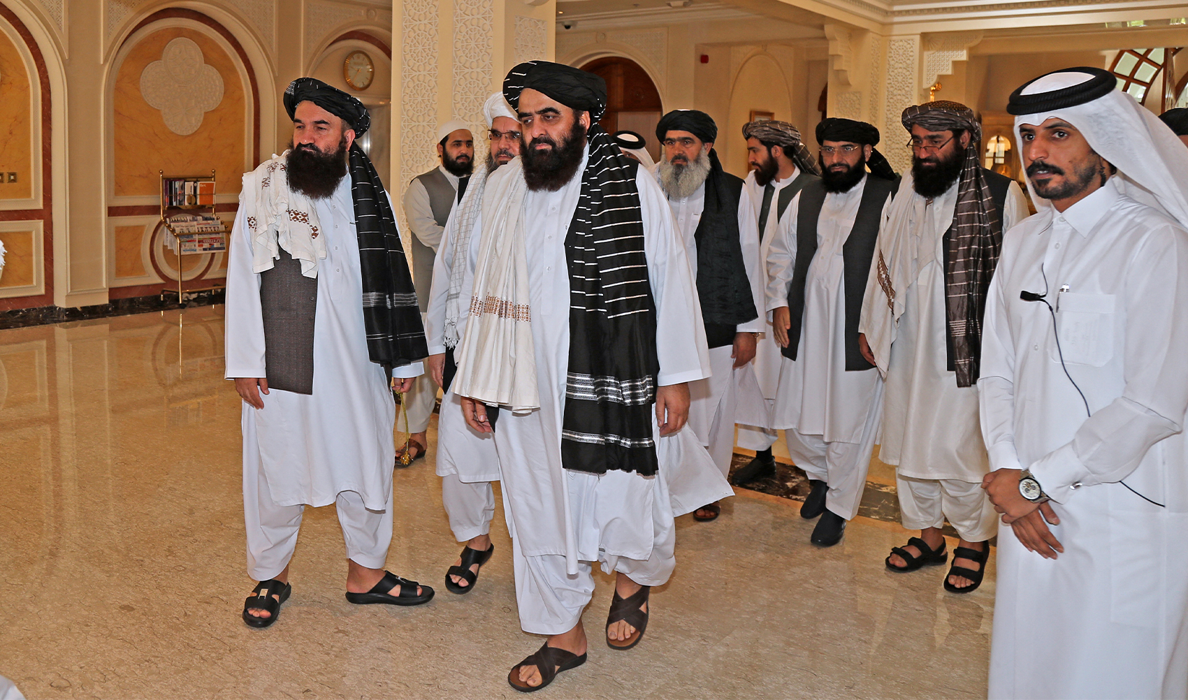 Members of the Taliban delegation arrive for a meeting with foreign diplomats in Qatar's capital Doha, on October 12, 2021. (AFP/File)