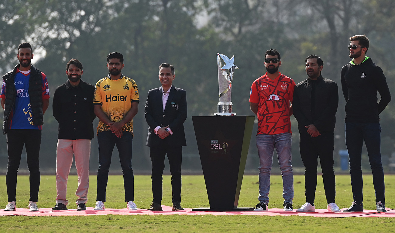 Pakistan Super League (PSL) team captains Shaheen Shah Afridi (R) of Lahore Qalandars, Sarfraz Ahmed (2R) of Quetta Gladiators, Shadab Khan (3R) of Islamabad United, Shan Masood (L) of Karachi Kings, Mohammad Rizwan (2L) of Multan Sultans and Babar Azam (3L) of Peshawar Zalmi pose during the PSL trophy unveiling ceremony at the Gaddafi Cricket Stadium in Lahore on February 13, 2024. (AFP/File)