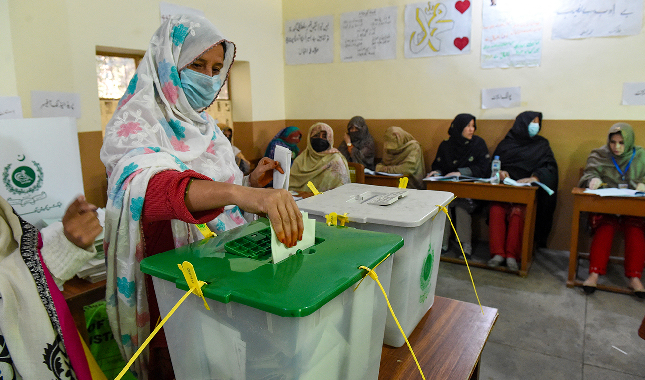 A woman casts her ballot to vote during Pakistan's national elections, at a polling station in Quetta on February 8, 2024. (AFP/File)