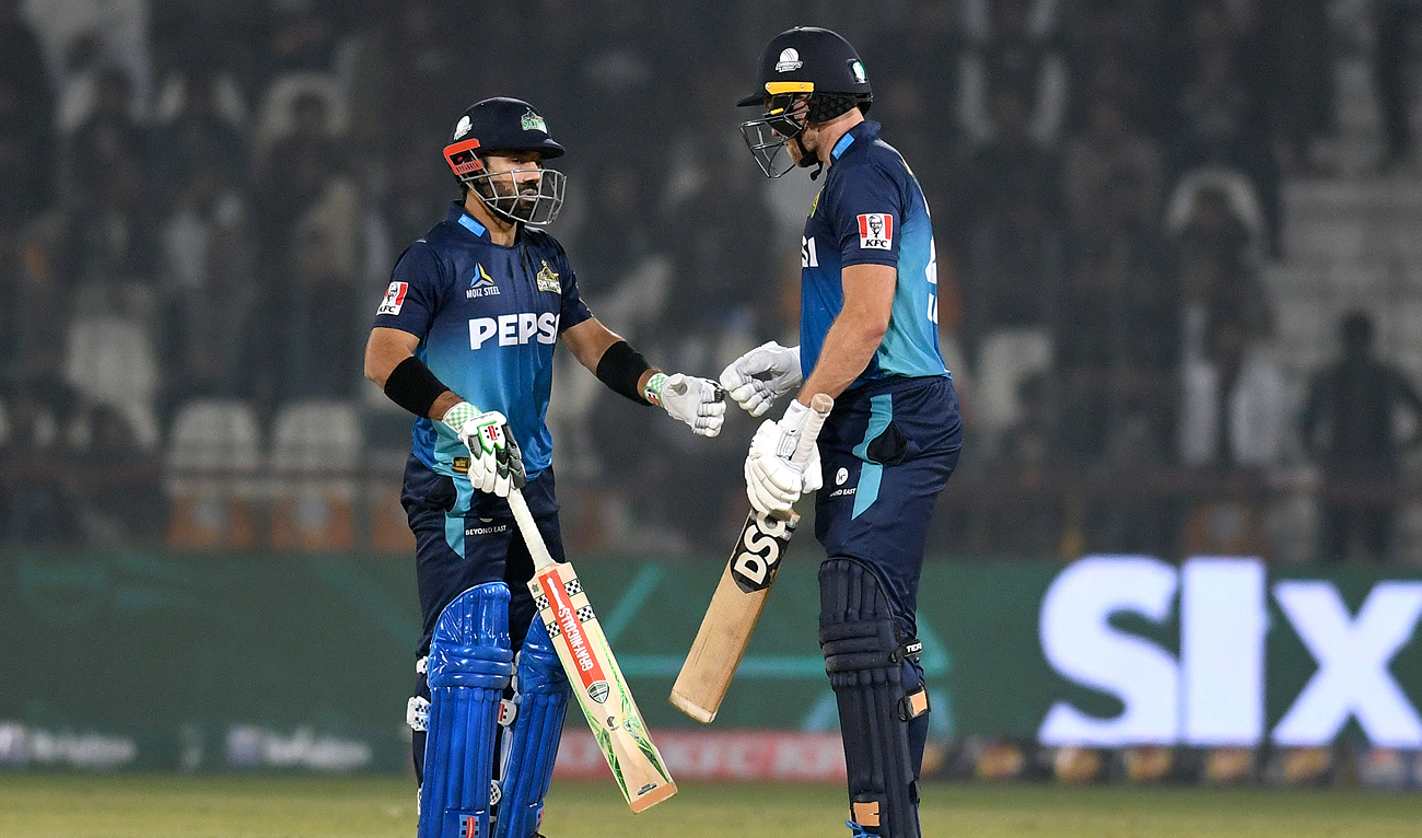 Multan Sultans' Mohammad Rizwan, left, celebrates with David Willey after hitting a boundary during the Pakistan Super League T20 cricket match between Multan Sultans and Lahore Qalandars in Multan, Pakistan on February 21, 2024. (AP)