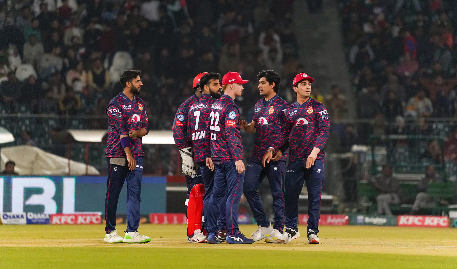 Islamabad United players celebrate after taking a wicket in a match against Quetta Gladiators in Lahore, Pakistan, on February 22, 2024. (Pakistan Cricket Board)