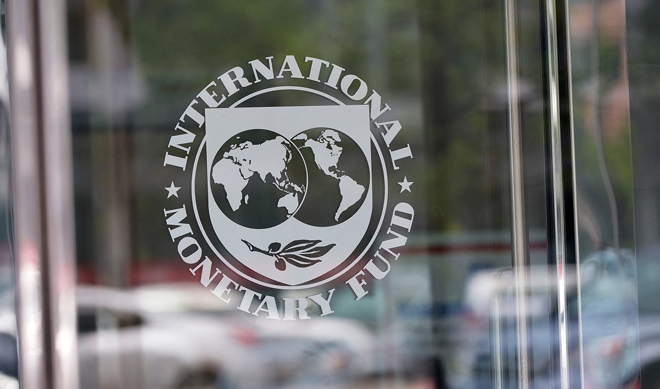 The seal of the International Monetary Fund is seen at the headquarters building in Washington, DC on July 5, 2015. (AFP/File)