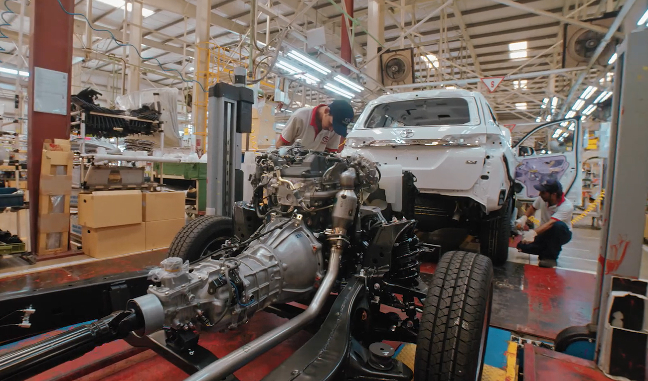 The still image taken from a video posted on January 2, 2019, shows workers assembling a car at an Indus Motor Company plant in Pakistan. (Photo courtesy: Indus Motor Company)
