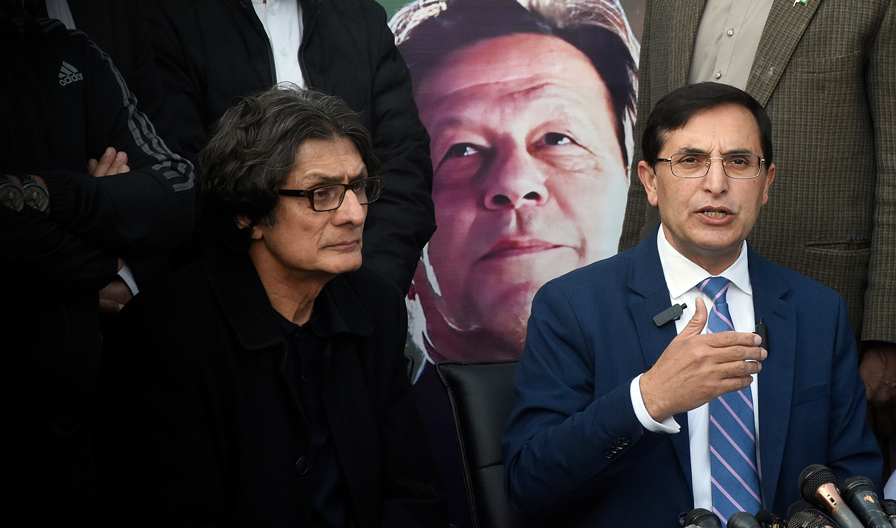 Gohar Khan, center, chairman of Pakistan Tehreek-e-Insaf (PTI) speaks during a press conference in Islamabad on February 10, 2024. (AP)