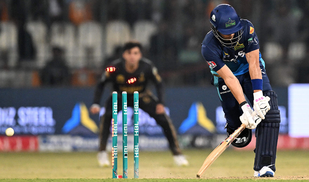 Multan Sultans’ Reeza Hendricks is clean bowled during the Pakistan Super League (PSL) Twenty20 cricket match between Multan Sultans and Peshawar Zalmi at the Multan Cricket Stadium in Multan on February 23, 2024. (AFP)