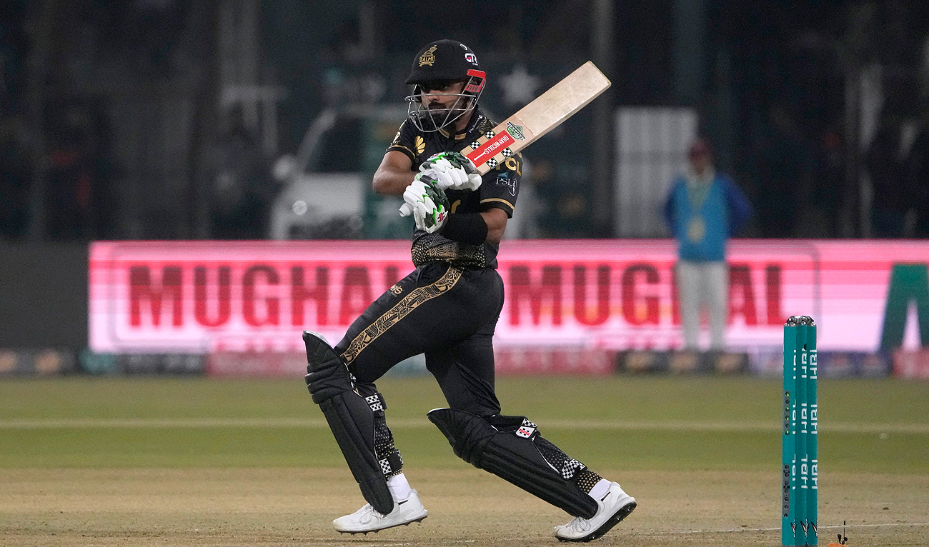 Peshawar Zalmi’s Babar Azam plays a shot during the Pakistan Super League T20 cricket match between Lahore Qalandars and Peshawar Zalmi, in Lahore on February 25, 2024. (AP)