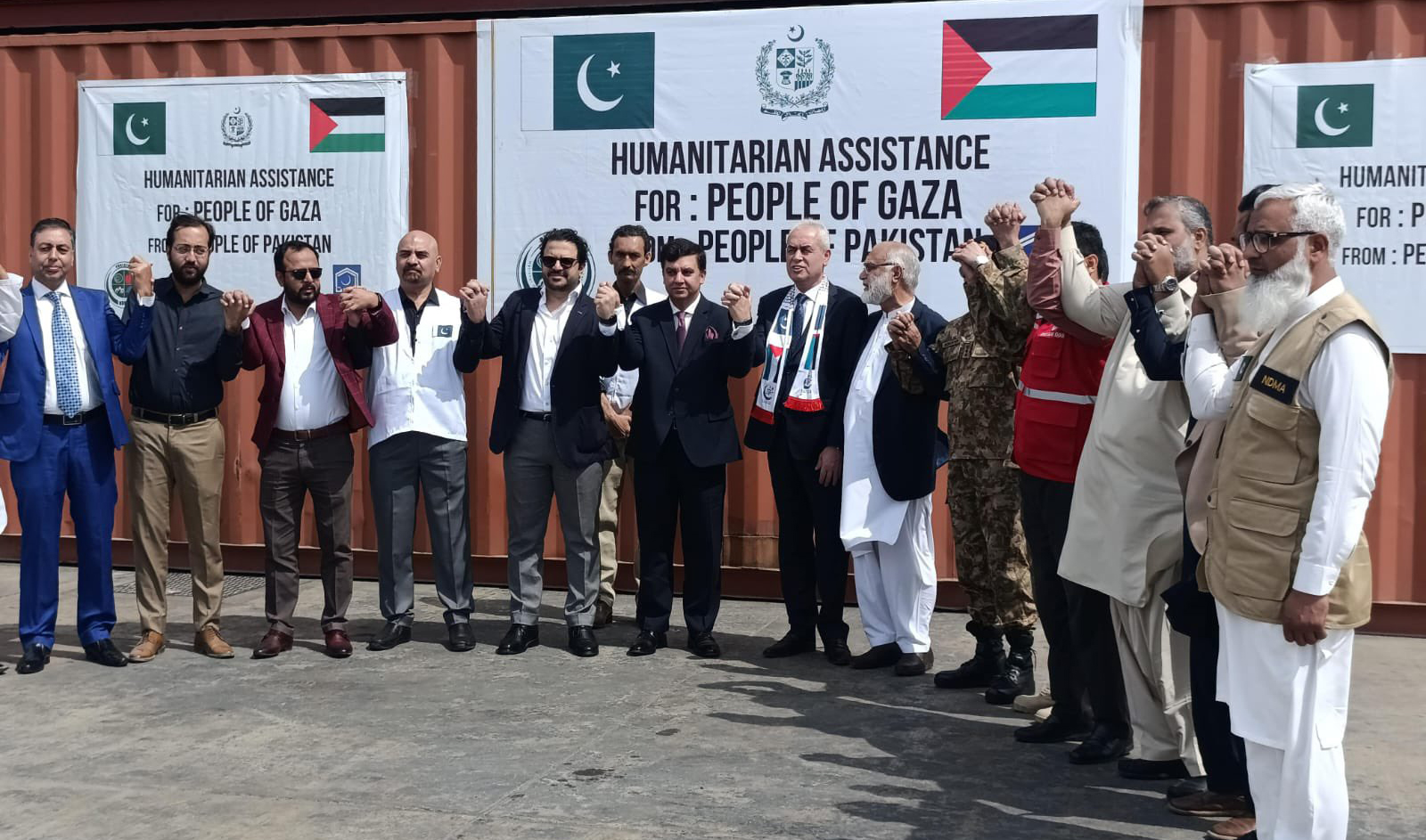 Diplomats and Pakistan’s disaster management authority officials dispatch relief goods to Gaza via cargo ship from Karachi on February 25, 2024. (NDMA)