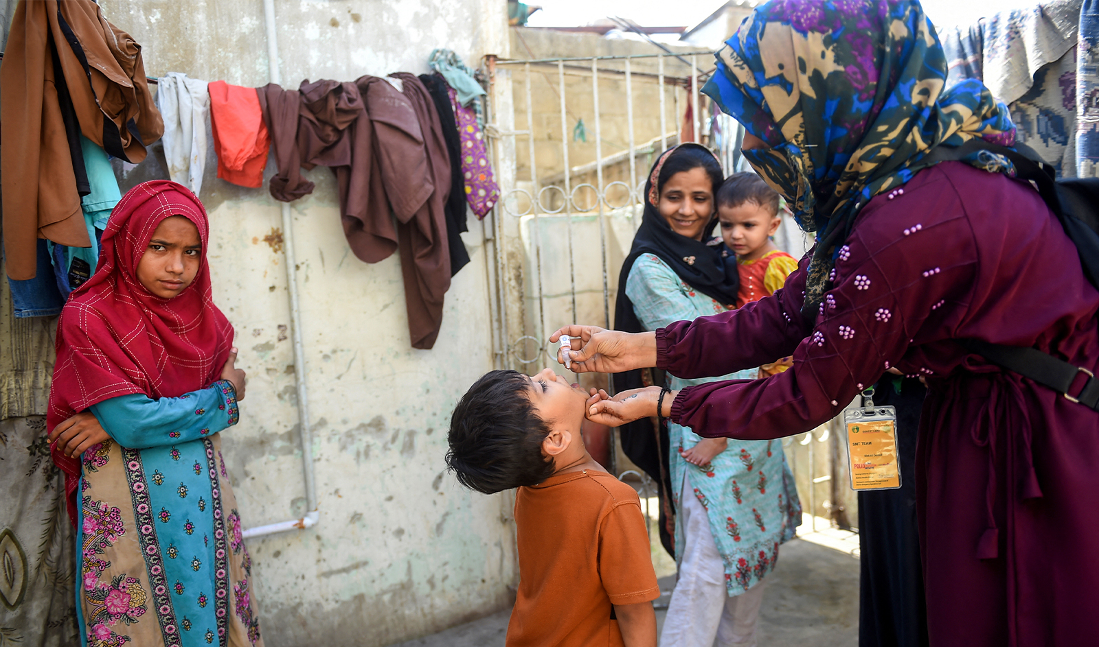 A health worker administers polio drops to a child during a door-to-door vaccination campaign in Karachi on October 2, 2023. (AFP)