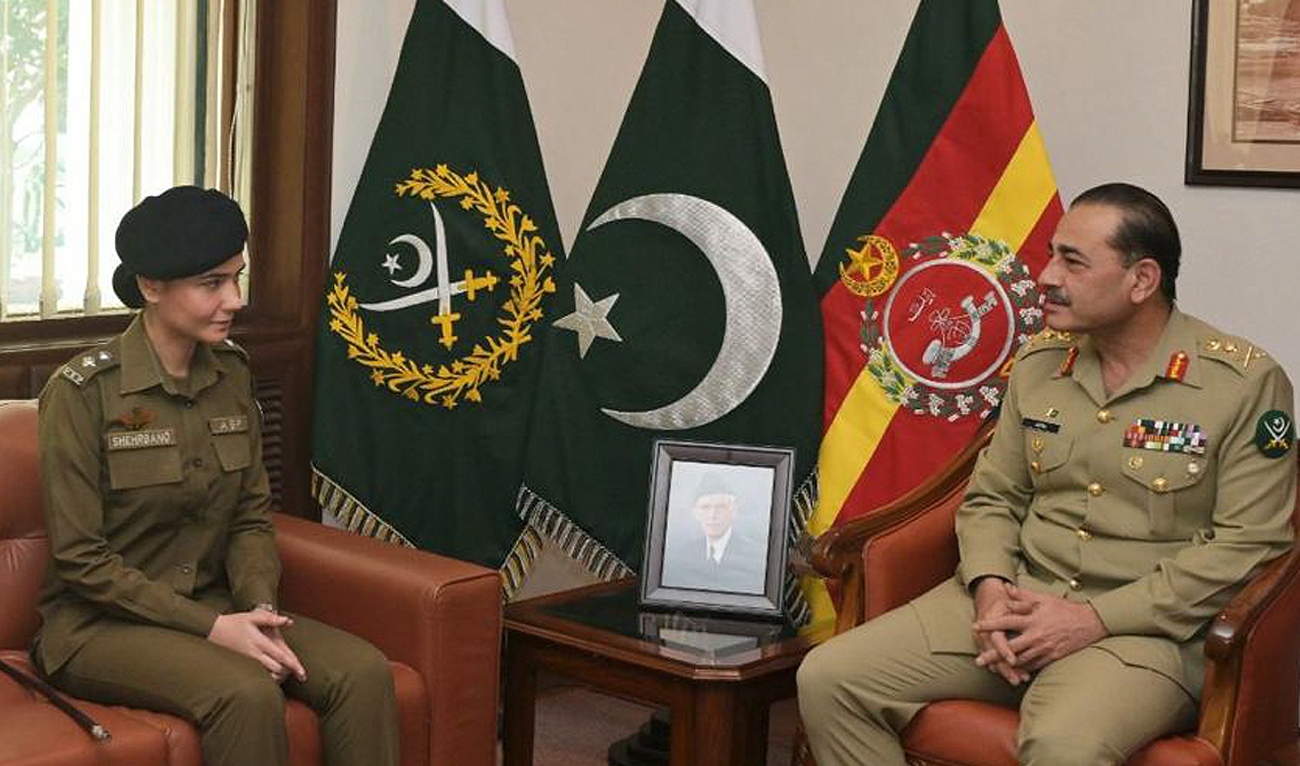 In this handout photo, taken and released by Pakistan’s Inter-Service Public Relations (ISPR), Pakistan Army Chief General Asim Munir right meets Syeda Shehrbano Naqvi, an assistant superintendent with Punjab police, at Generals Headquarters in Rawalpindi on February 28, 2024. A police officer who saved a woman accused of blasphemy from a mob of 200 men in eastern Pakistan has described how she had to negotiate with the crowd to lead her to safety. The woman, who has not been named for security reasons, was surrounded in a Lahore restaurant by men who wrongly claimed her shirt was adorned with verses from the Quran. (Photo courtesy: ISPR)