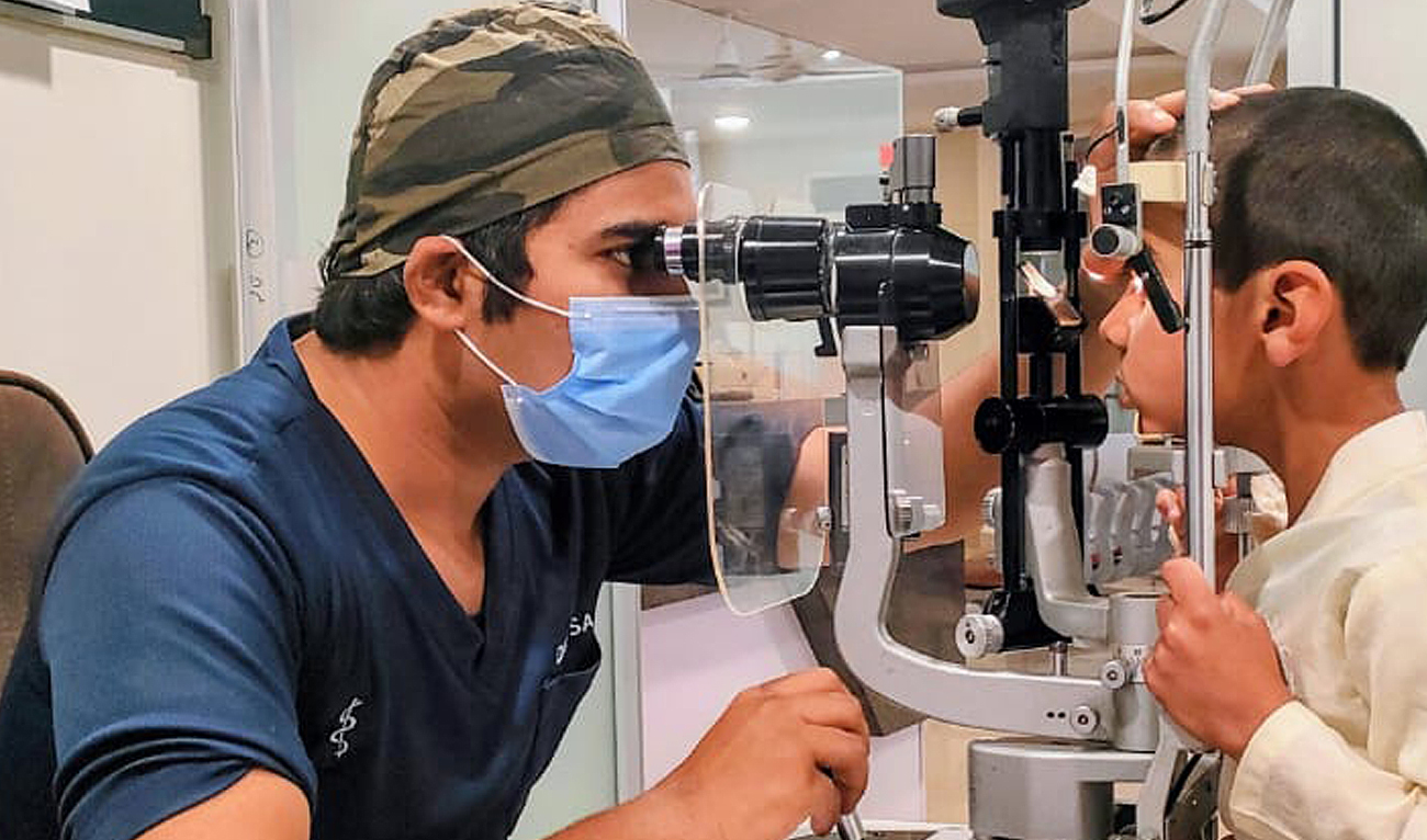 In this photo, posted on February 27, 2024, Pakistani doctor examines a boy suffering from an eye infection at a hospital in Rawalpindi. (Photo courtesy: Facebook/AlShifaHospital)