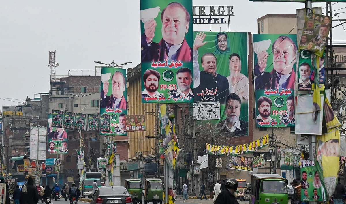 A street is festooned with posters of Pakistan's former Prime Minister and leader of the Pakistan Muslim League (PML) party, Nawaz Sharif in Lahore on February 4, 2024, ahead of national elections. (AFP)