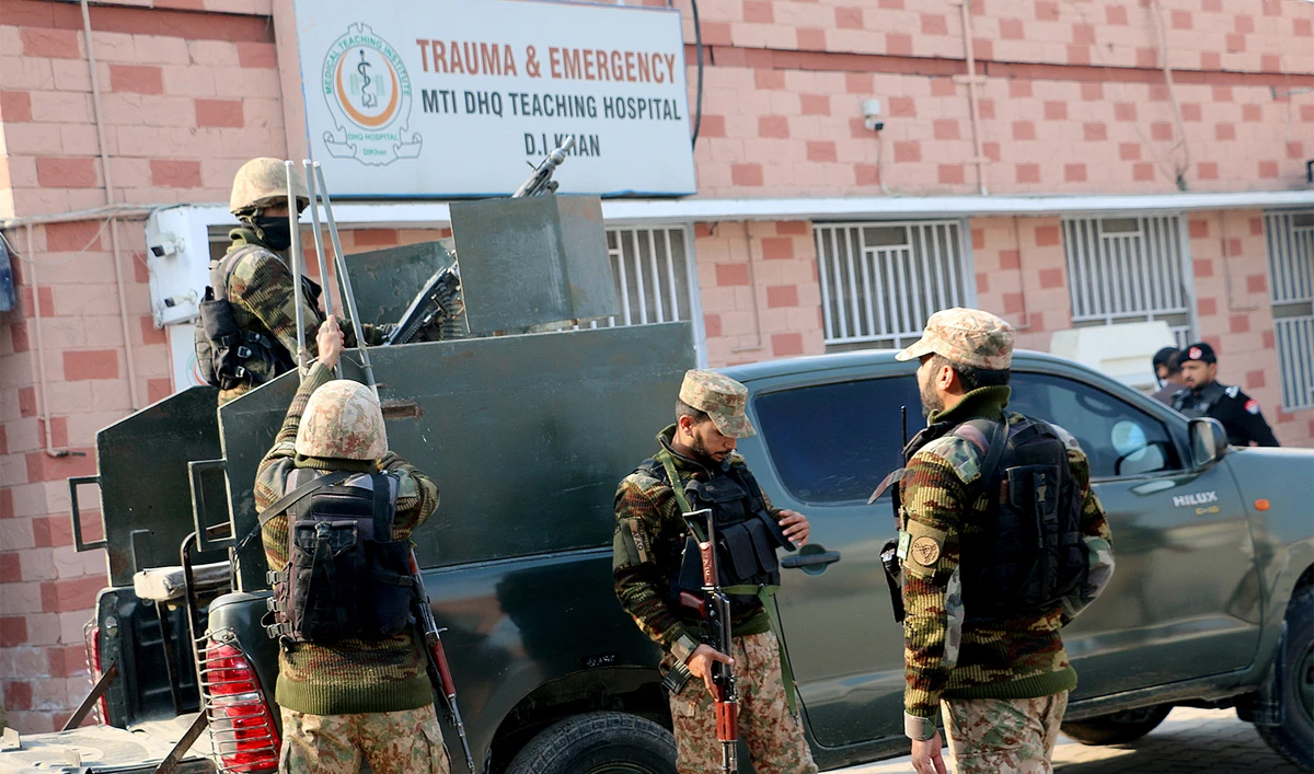 Security personnel stand guard outside a hospital where injured police officers are treated after a militant attack on a police station in Dera Ismail Khan, Pakistan, on February 5, 2024. (REUTERS)
