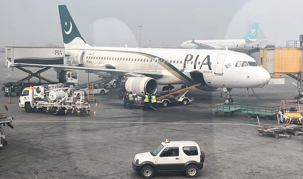iew of a Pakistan International Airlines (PIA) passengers plane, taken through a glass panel, at the Allama Iqbal International Airpor in Lahore, Pakistan on January 29, 2024. (REUTERS)