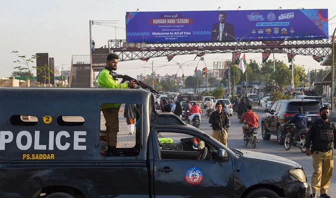 Policemen stand guard along a street in Karachi on February 1, 2024, ahead of the general elections. (AFP/File)