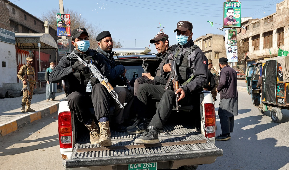 Military troops patrol during Pakistan's national elections in Peshawar on February 8, 2024. (AFP)