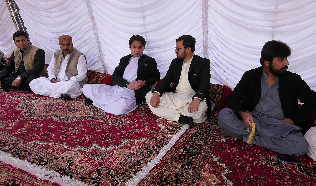 In this photo, taken on February 12, 2024, Nawabzada Jamal Khan Raisani (3rd right) greets people at his residence 'Sarawan House' in Quetta, who have arrived to congratulate him as he prepares to begin his career as the country’s youngest ever directly elected parliamentarian. (AN Photo)