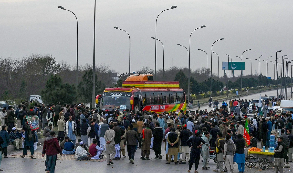 Supporters of Khan's Pakistan Tehreek-e-Insaf (PTI) party block Peshawar to Islamabad highway as they protest against the alleged skewing in Pakistan's national election results, in Peshawar on February 12, 2024. (AFP)