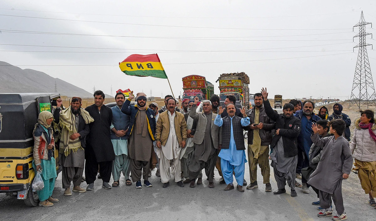 Supporters of Balochistan National Party, Pashtunkhwa Milli Awami Party and Hazara Democratic Party protest against the alleged skewing in Pakistan's national election results, as they block the Quetta-Sibi highway in Balochistan on February 18, 2024. (AFP)