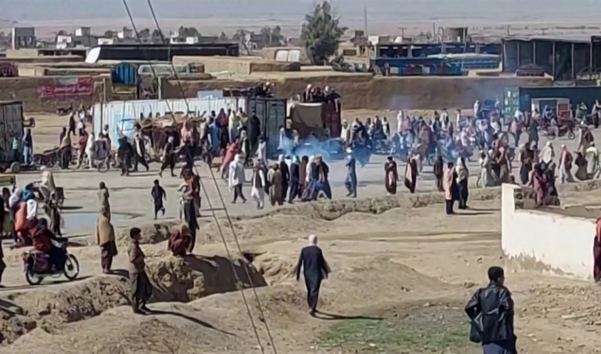 Pakistan border guards use tear gas to disperse people protesting against the implementation of a visa and passport regime for travel through a main border crossing with Afghanistan at Chaman border, Pakistan, on February 20, 2024. (REUTERS)