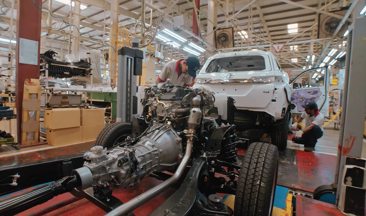 The still image taken from a video posted on January 2, 2019, shows workers assembling a car at an Indus Motor Company plant in Pakistan. (Photo courtesy: Indus Motor Company)