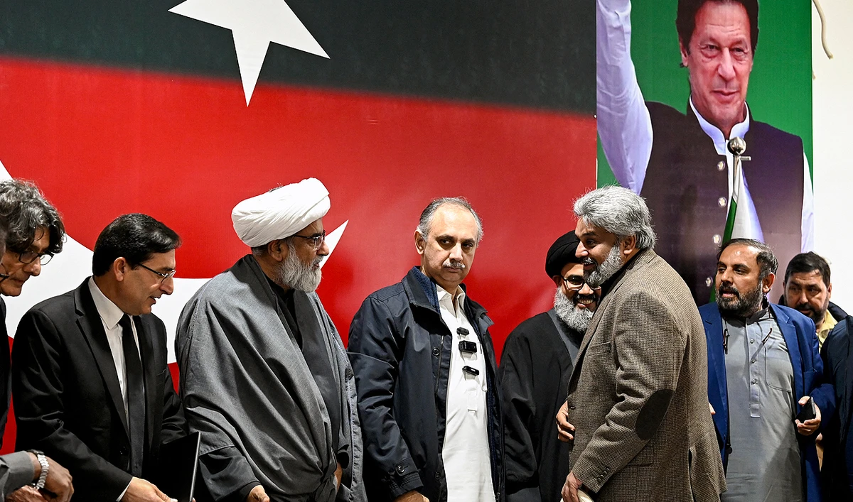 Omar Ayub Khan (4L), nominee for prime minister from Pakistan Tehreek-e-Insaaf (PTI) party, Gohar Ali Khan (2L) PTI's chairman and barrister speak with Sahibzada Muhammad Hamid Raza (3R), leader of the political group Sunni Ittehad Council during a press conference following their coalition in Islamabad on February 19, 2024. (AFP)