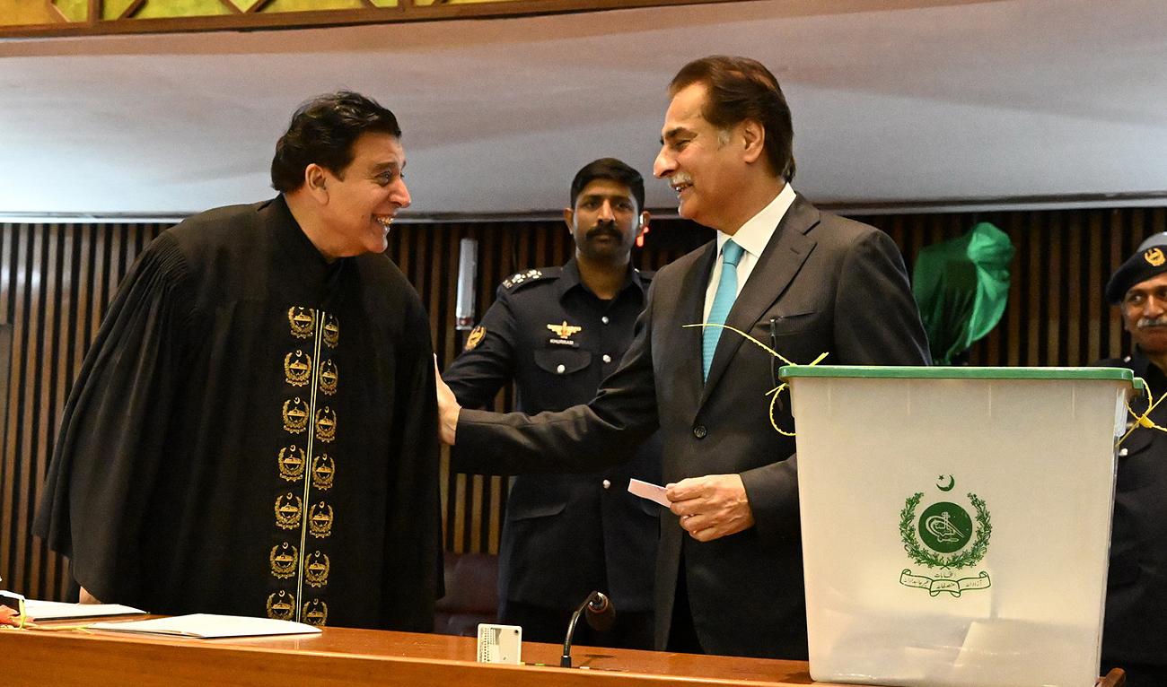 In this handout photo, taken and released by the Government of Pakistan, Parliament’s newly-elected speaker Sardar Ayaz Sadiq (right) speaks to the outgoing speaker, Raja Pervaiz Ashraf, during the voting process for the 23rd speaker of Pakistan’s National Assembly in Islamabad on March 1, 2024. (Photo courtesy: Facebook/ NationalAssemblyOfPakistan)