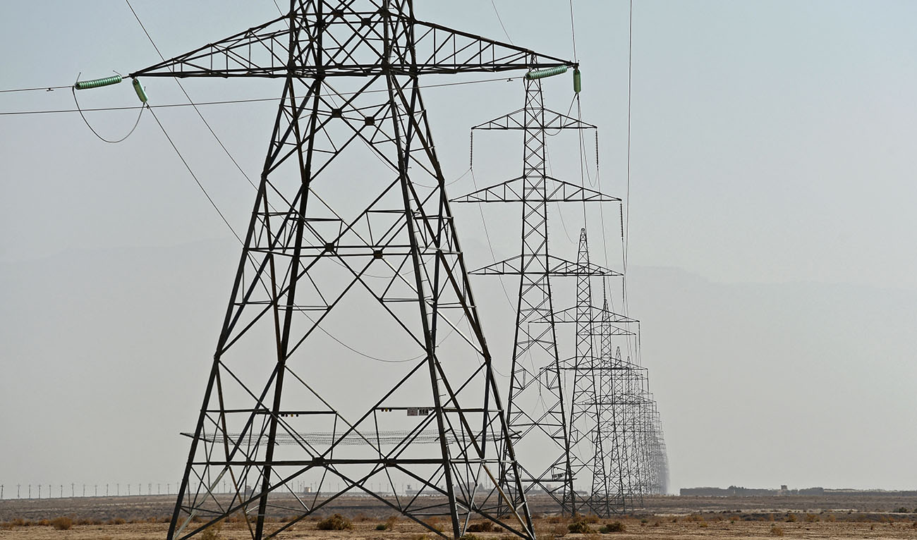 In this photograph taken on October 27, 2021, power pylons transmitting electricity from Uzbekistan to Afghanistan are pictured along the Hairatan Highway in Kaldar district of Balkh Province. (AFP/File)