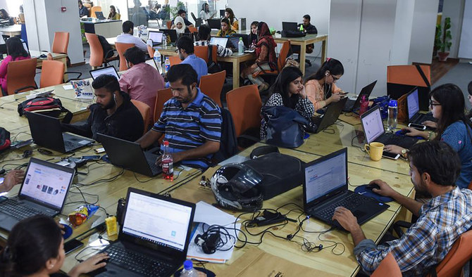 Employees of online marketplace company Kaymu at work in Karachi, Pakistan, on November 19, 2015. (AFP/File)