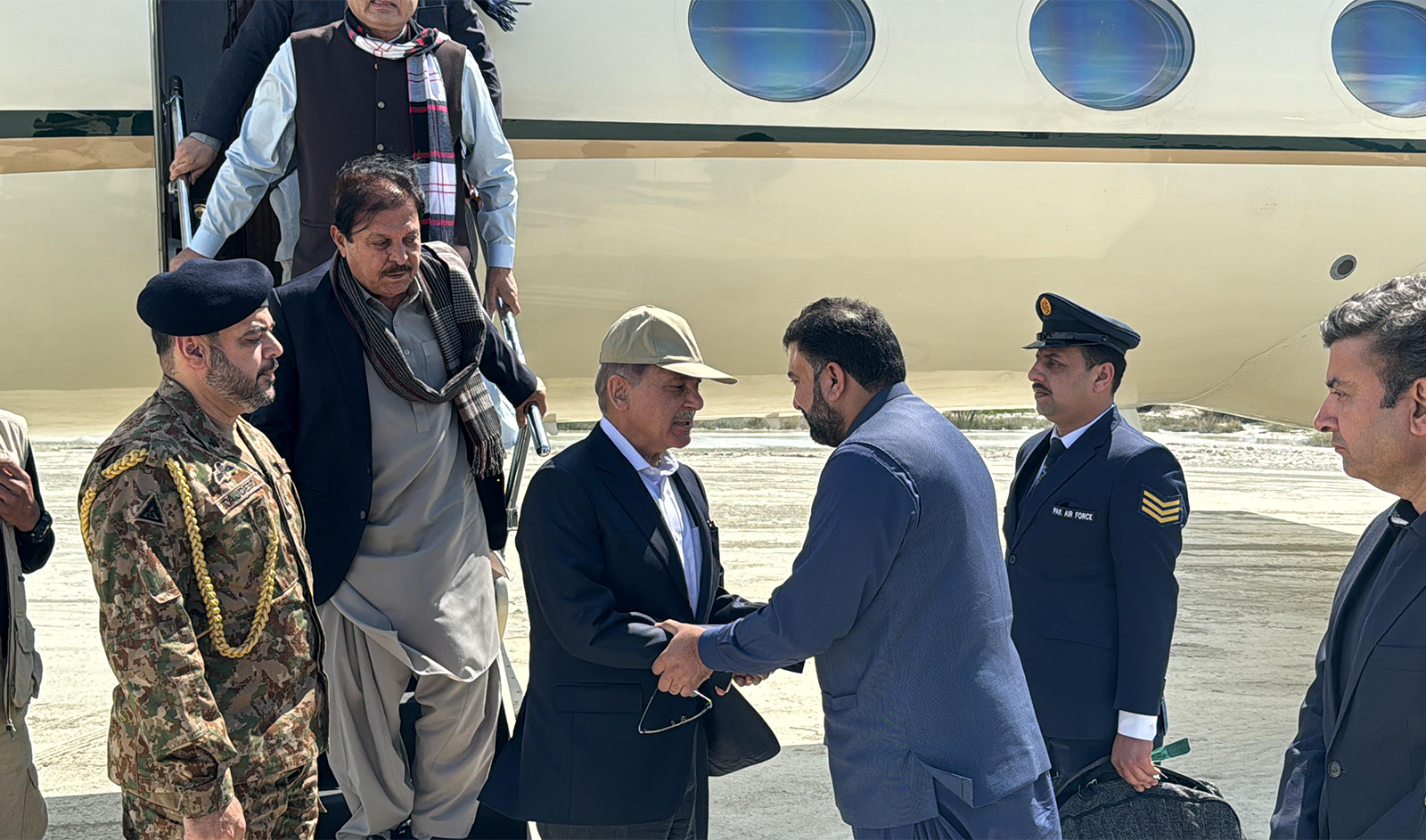 Pakistan Prime Minister Shehbaz Sharif (second left) shakes hand with Balochistan’s newly elected Chief Minister Sarfaraz Bugti as he arrives in Gwadar, Pakistan, on March 5, 2024 to inspect relief operations. (Government of Pakistan)