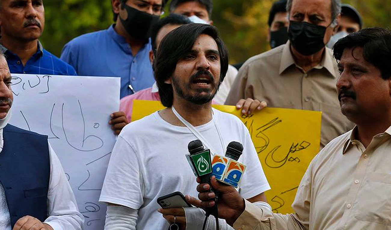 In this file photo, taken on May 28, 2021, Pakistani journalist Asad Ali Toor, center, speaks during a demonstration called by journalists union to condemn the attack on journalists, in Islamabad. (AP/File)