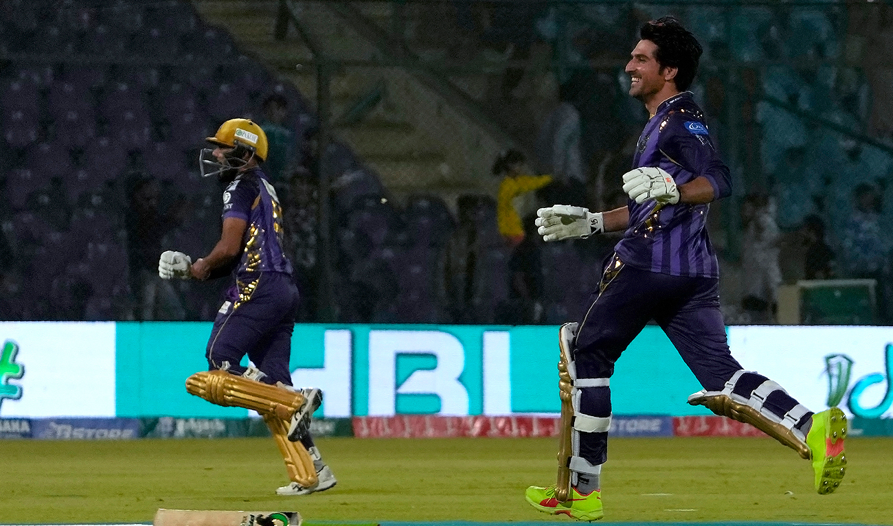 Quetta Gladiators’ Mohammad Wasim, right, and Saud Shakeel celebrate after winning the the Pakistan Super League T20 cricket match against Lahore Qalandars, in Karachi, on March 10, 2024. (AP Photo)