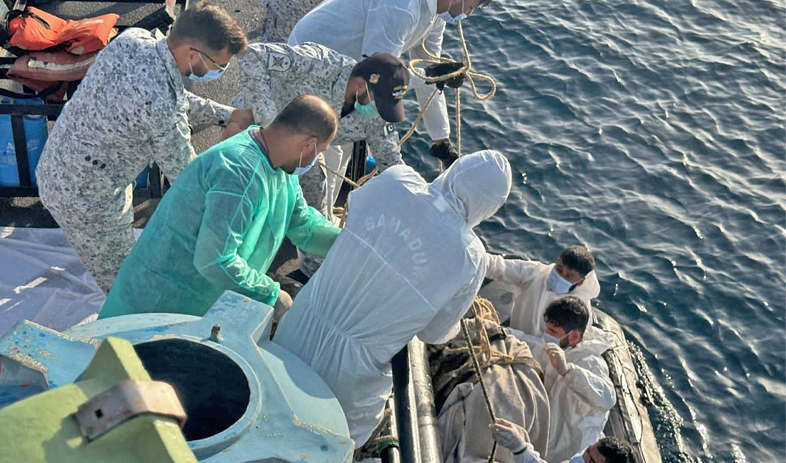 The picture shared on March 13,2024 shows officials of Pakistan Maritime Security Agency (PMSA) and Pakistan Navy carry out a search operation for missing fishermen in Arabian Sea. (Pakistan Maritime Security Agency)