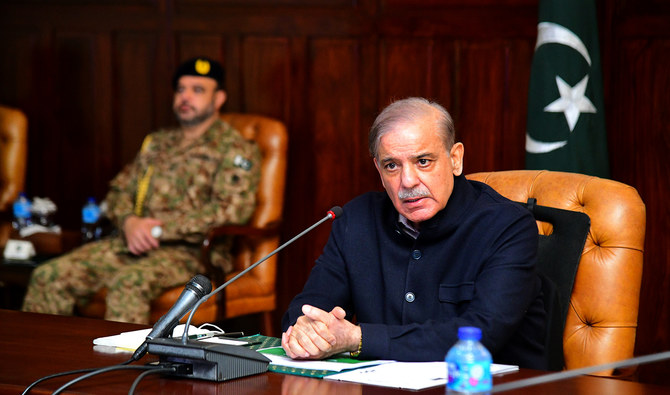 In this handout photo, taken and released by Prime Minister Office, Pakistan Prime Minister Shehbaz Sharif chairs meeting to monitor the rain and flood situation in Khyber Pakhtunkhwa province at the Governor House in Peshawar on March 6, 2024. (Photo courtesy: PMO)