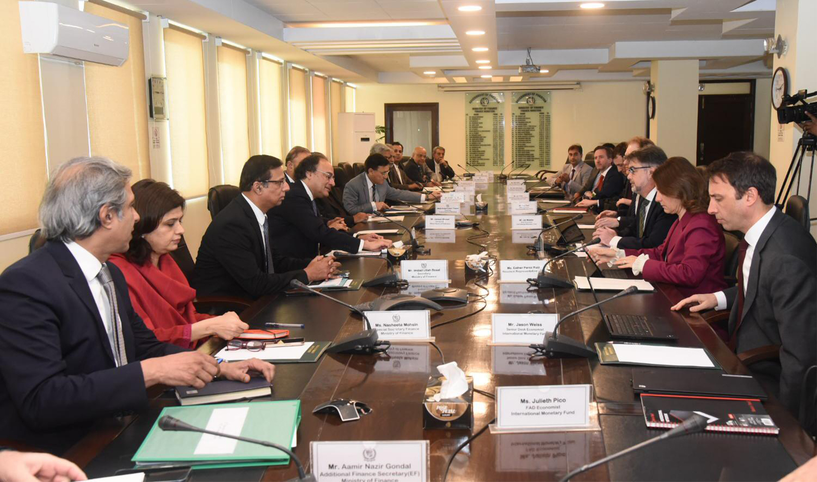 IMF mission in Pakistan (right) calls on Pakistani finance minister Muhammad Aurangzeb (fourth in the left row) to conduct the final review of the $3 billion short-term financing program in Islamabad, Pakistan, on March 14, 2024. (Pakistan's finance ministry)