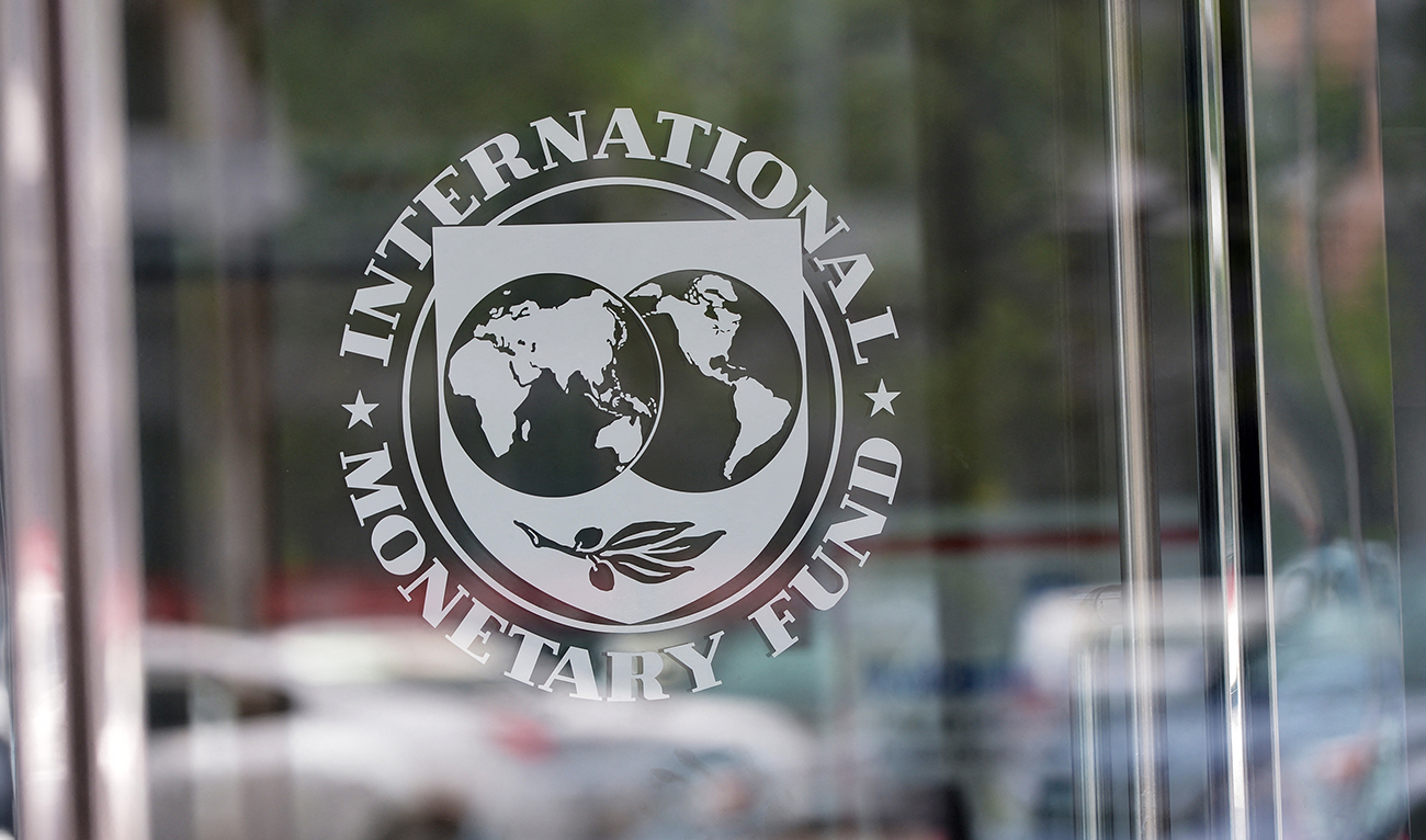 The seal of the International Monetary Fund is seen at the headquarters building in Washington, DC on July 5, 2015. (AFP/File)