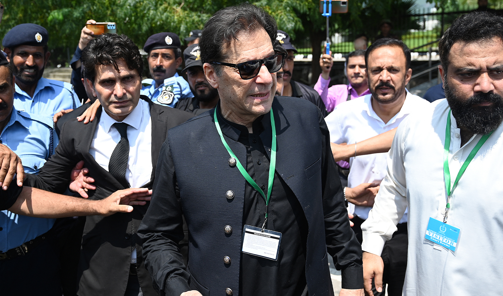 Pakistan’s former Prime Minister Imran Khan (C) leaves after appearing in the Supreme Court in Islamabad on July 24, 2023. (AFP/File)
