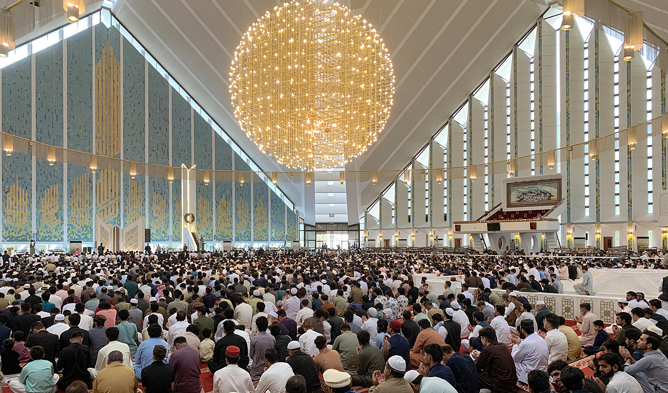 Muslim devotees gather to offer a morning prayer at the grand Faisal Mosque in Islamabad on April 22, 2023. (AFP/File)