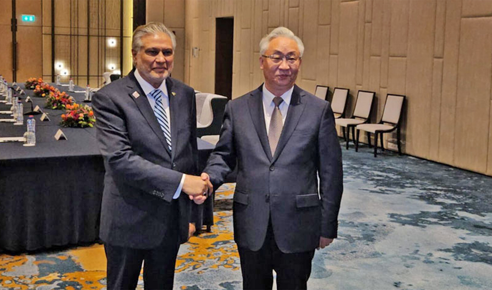 Pakistan's foreign minister Ishaq Dar (left) shakes hands with China’s Vice Premier Zhang Guoqing in Brussels on the sidelines of the First Nuclear Energy Summit on March 22, 2024. (PID)