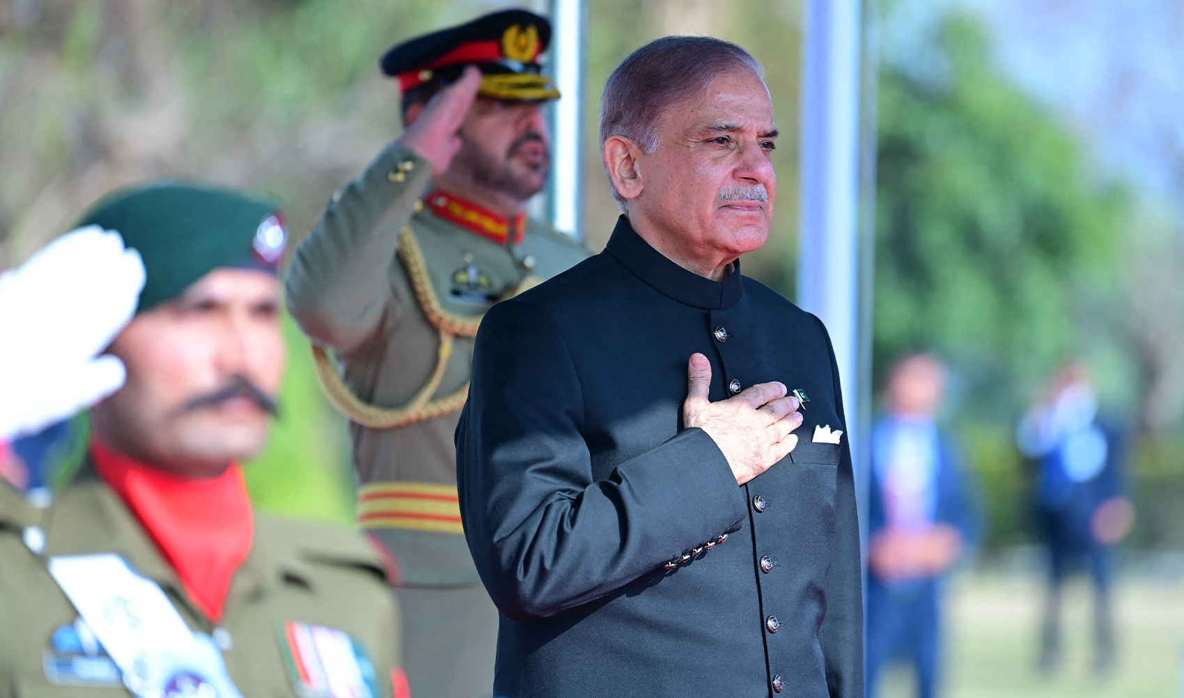 In this handout picture taken and released by Pakistan Prime Minister's Office on March 4, 2024, Pakistan's newly sworn-in Prime Minister Shehbaz Sharif (R) inspects the guard of honor at the Prime Minister House in Islamabad. (AFP/File)
