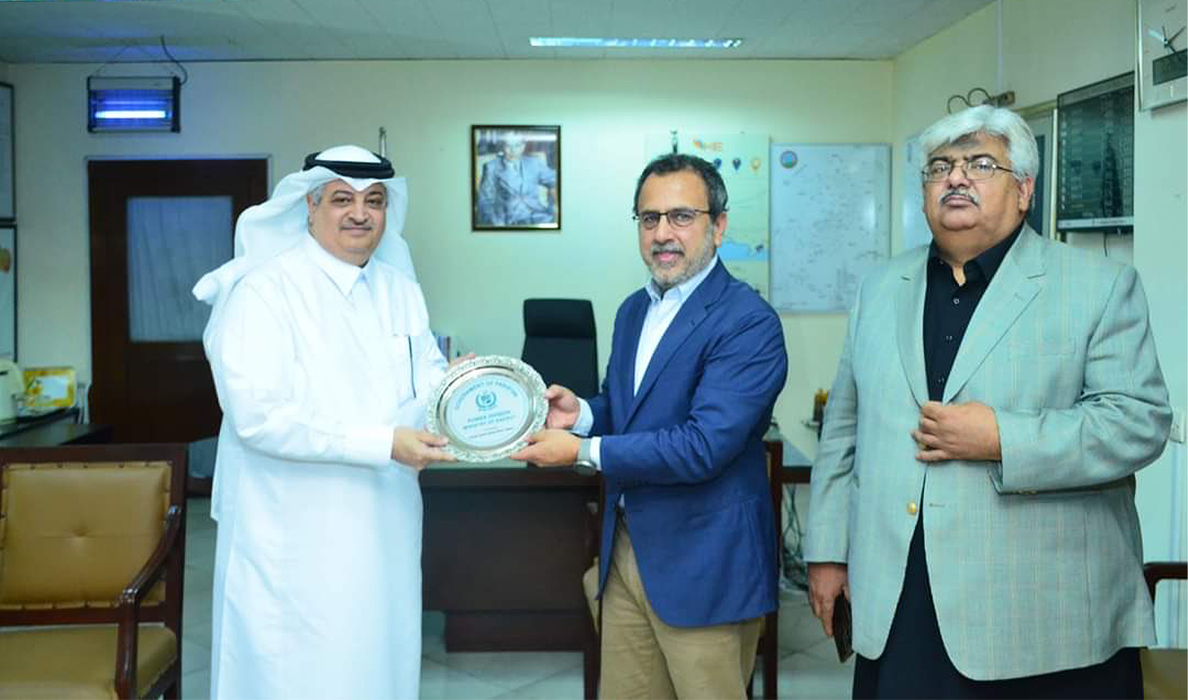 Pakistani Minister for Power Sardar Awais Ahmad Khan Leghari (2R) presents shield to Saudi Ambassador to Pakistan Nawaf bin Saeed Al-Malki (L) in Islamabad, Pakistan on March 25, 2024. (@MoWP15/X)