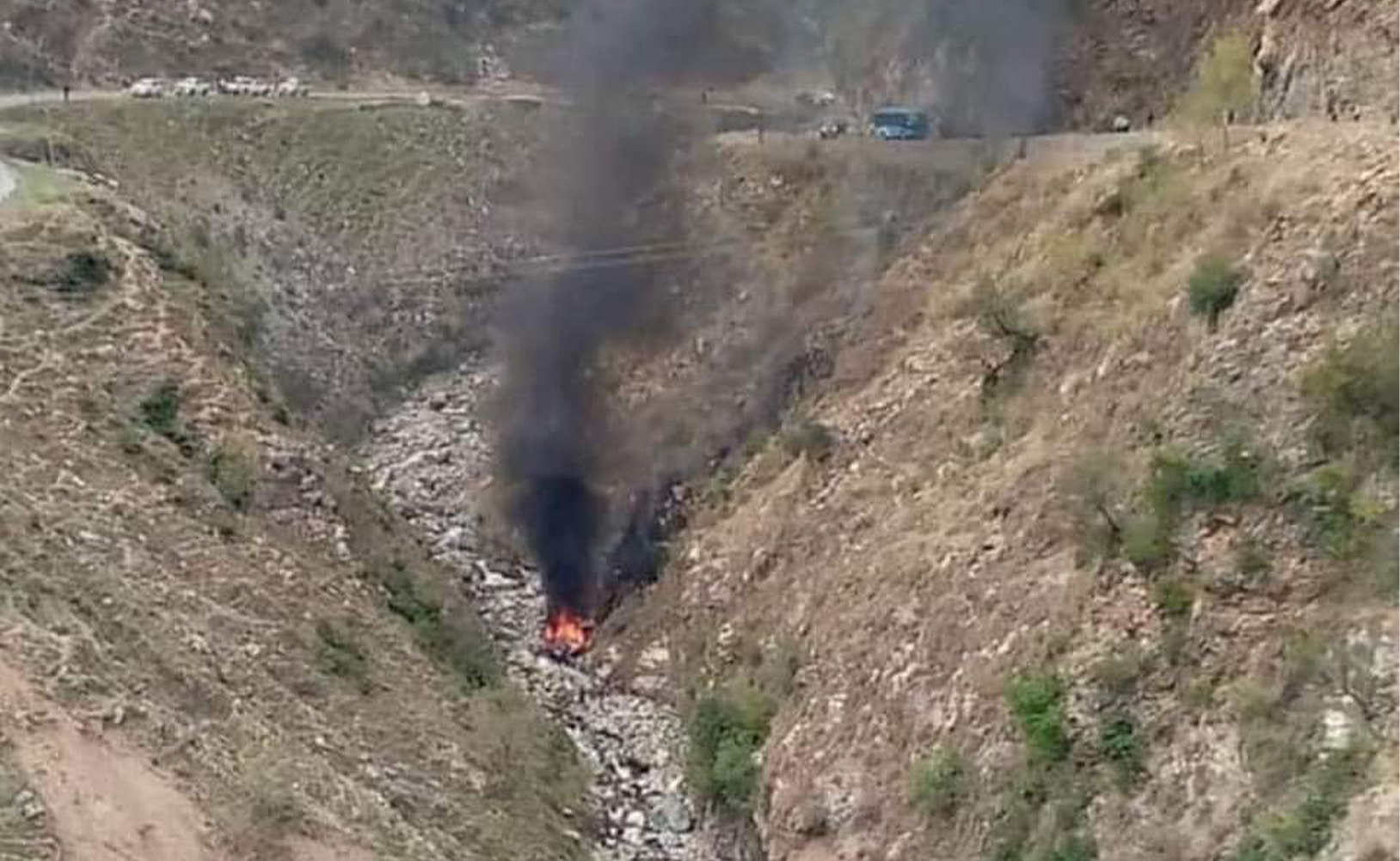 The picture circulating on social media shows a bus plunged into a ravine following an explosion in northwest Pakistan on March 26, 2024. (Social media)