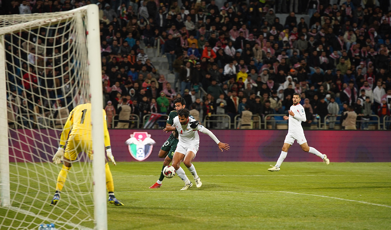 Pakistani and Jordanian players fight for the ball during the 2026 FIFA World Cup qualifier football match between Pakistan and Jordan at the Amman International Stadium in Amman on March 27, 2024. (Photo courtesy: PFF)