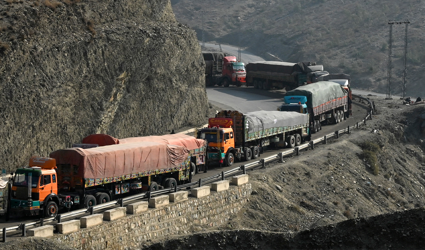 Stranded trucks are pictured near the Pakistan-Afghanistan border in Torkham on January 16, 2024. (AFP/File)