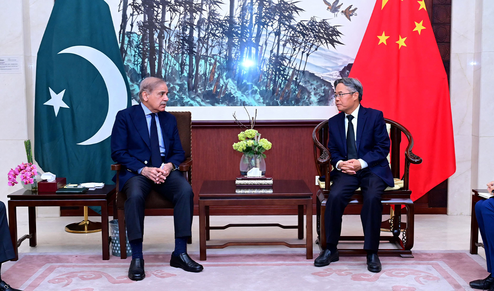 This handout photograph taken and released by Pakistan Prime Minister's Office on March 26, 2024 shows Pakistan's Prime Minister Shehbaz Sharif (L) speaking with Chinese Ambassador Jiang Zaidong during a meeting over the death of Chinese nationals who were killed in a suicide attack, at the Chinese Embassy in Islamabad. (AFP / Pakistan Prime Minister's Office)