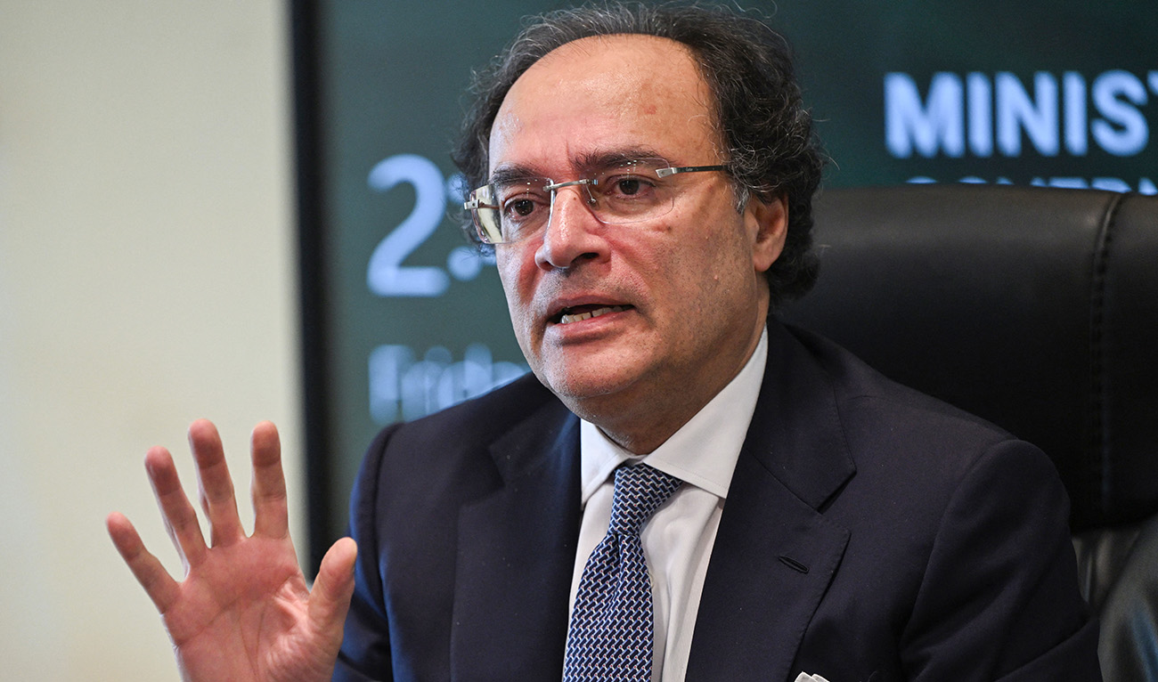 Pakistan Finance Minister Muhammad Aurangzeb gestures while speaking with media representatives at the finance ministry in Islamabad on March 22, 2024. (AFP/File)