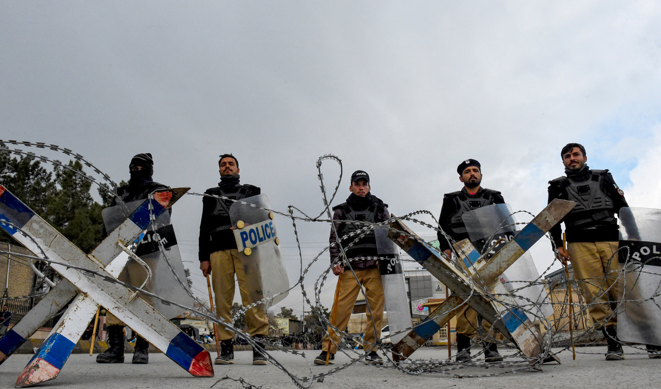 In this file photo, taken on February 28, 2024, Police personnel set roadblocks near the provincial legislature of Pakistan’s Balochistan Assembly in Quetta. (AFP/File)