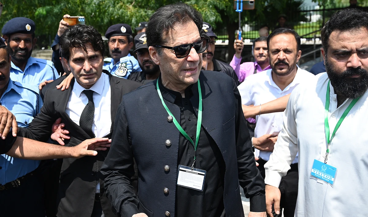 Pakistan’s former Prime Minister Imran Khan (C) leaves after appearing in the Supreme Court in Islamabad on July 24, 2023. (AFP/File)