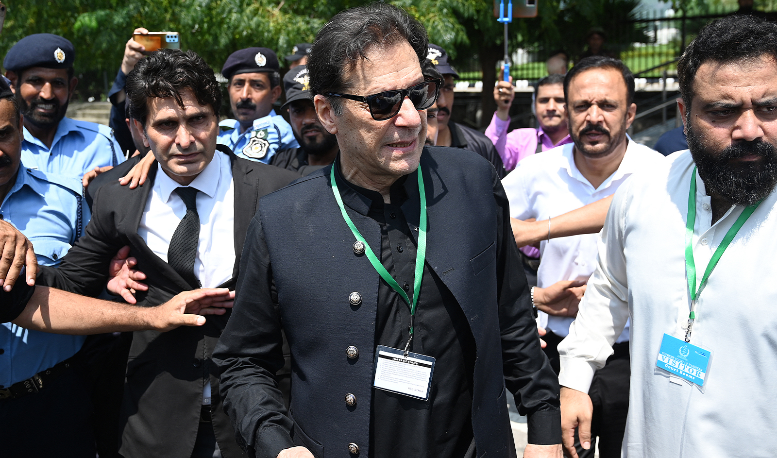 Pakistan’s former Prime Minister Imran Khan (C) leaves after appearing in the Supreme Court in Islamabad on July 24, 2023. (AFP/File)