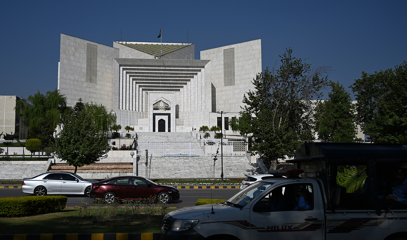 Motorists drive past Pakistan's Supreme Court in Islamabad on April 5, 2022. (AFP/File)
